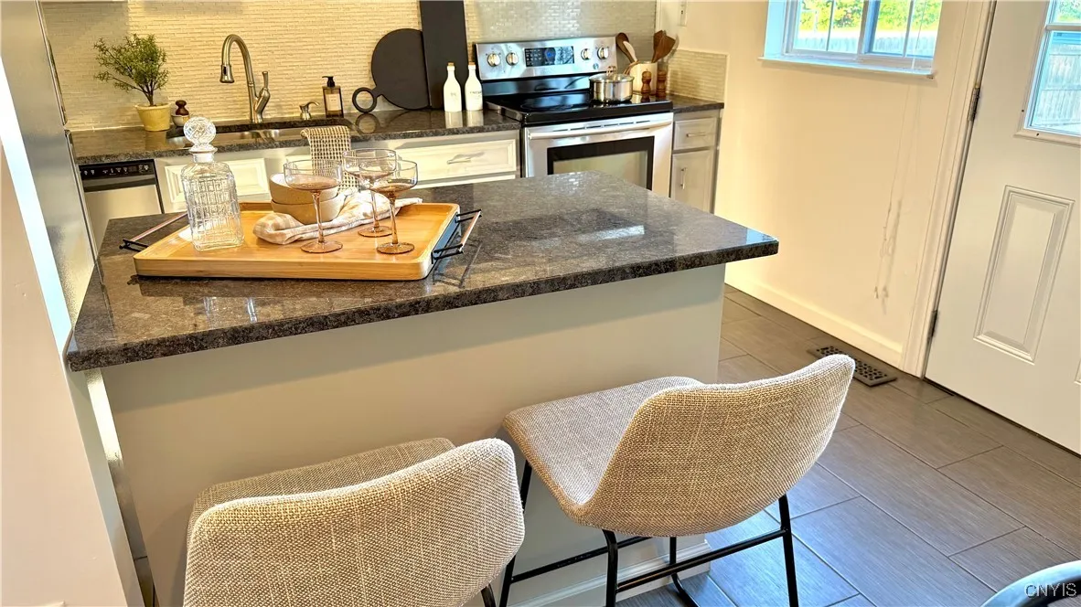 Granite countertops and painted cabinets in the kitchen