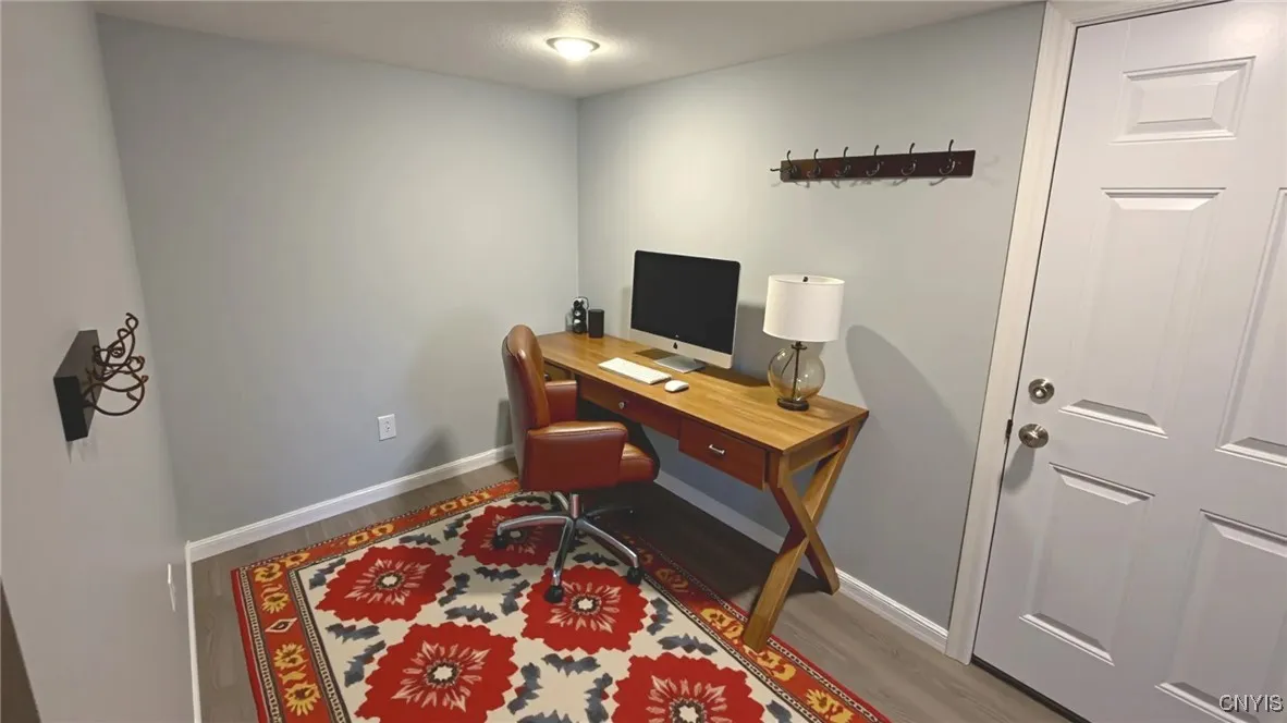 Virtually staged lower foyer - meant for illustrative purposes only. Actual room is unfurnished.