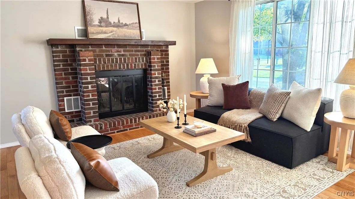 Living room with a wood-burning fireplace. This room was just painted.