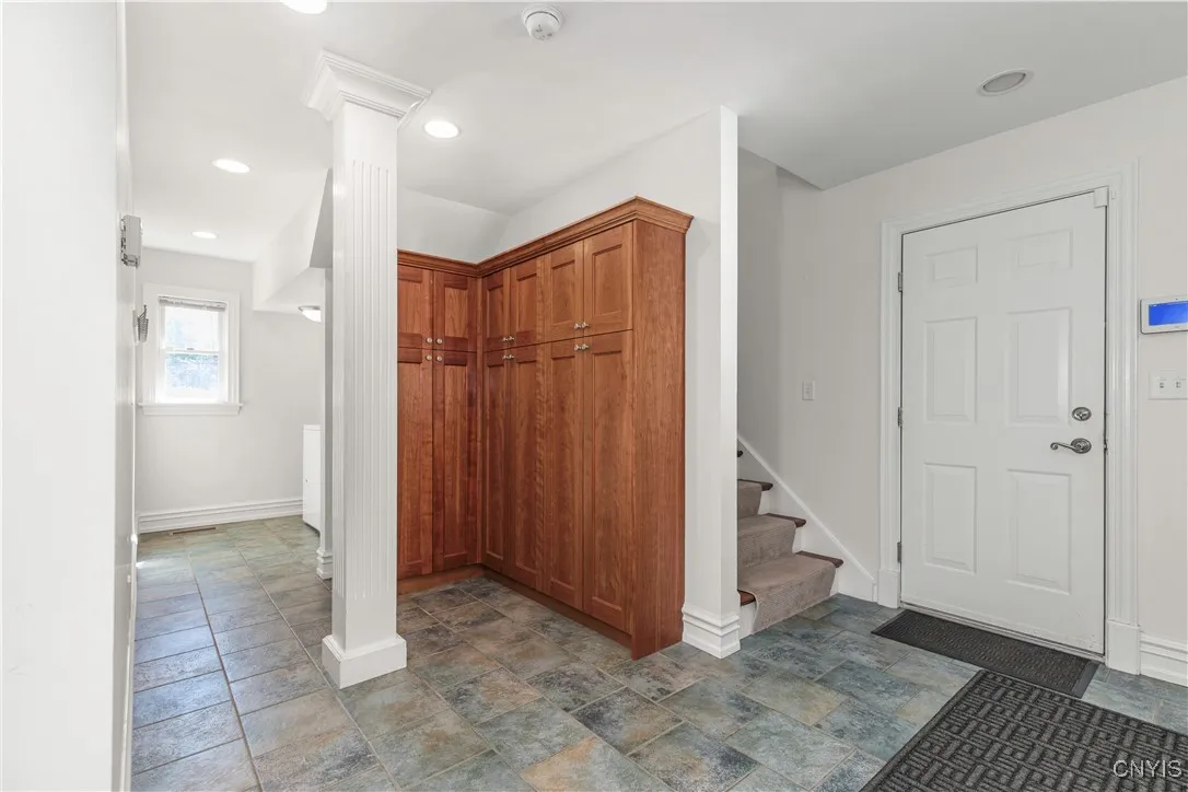 Mudroom and Laundry off of the garage.  Stairs lead up to the large bonus room above the garage.