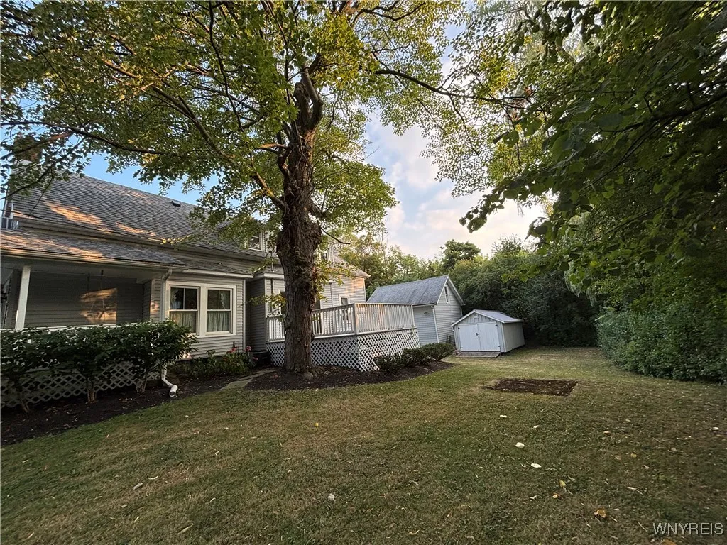 Not only is there a wraparound porch to the front, but also a side deck to overlook the back & side yard!
