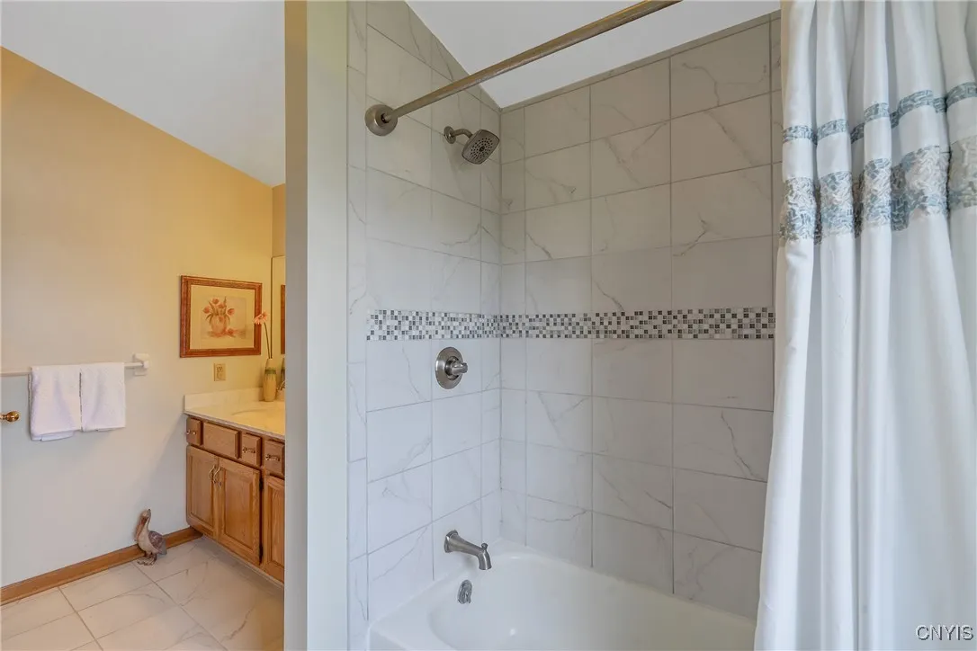 The stunning bath surround lends more to the pleasing aesthetic of this room.