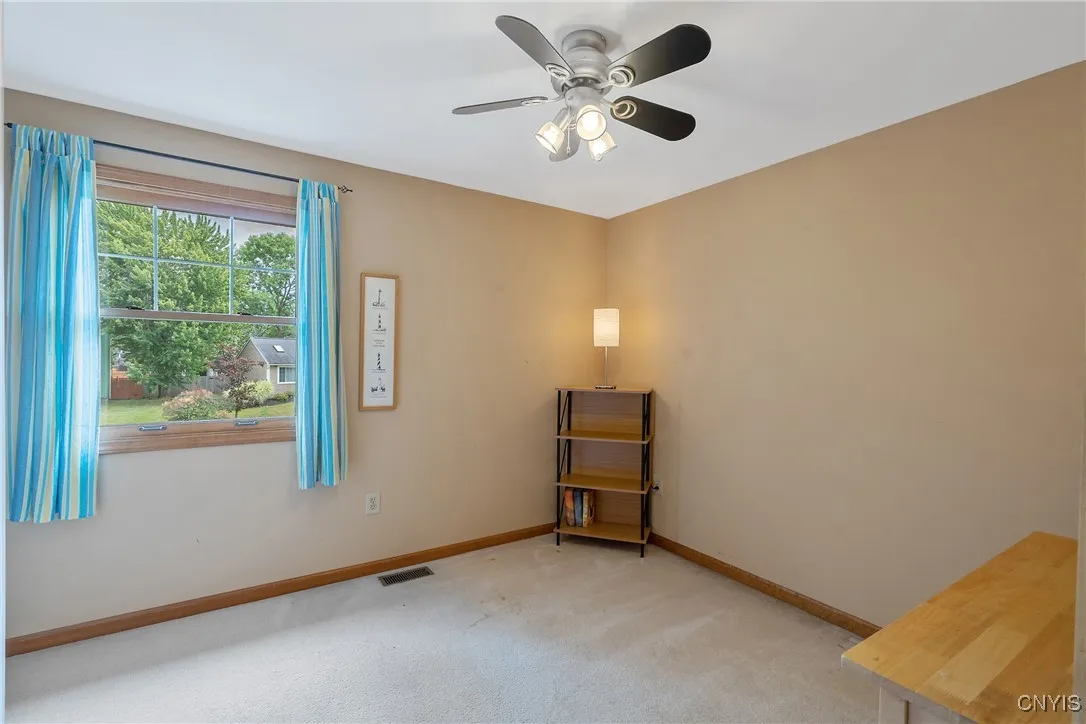 Now as we head upstairs to the bedroom level, we see the first of the four bedrooms here.  Overhead lighting was added in these rooms by the current owner elevating both convenience and design.