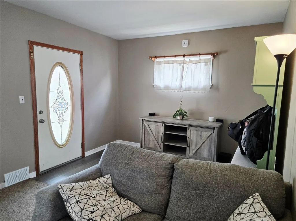 The front door has an oval inset and adds to the overall curb appeal.