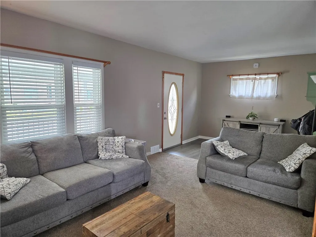 The full lite door and multiple windows also welcome the natural light.