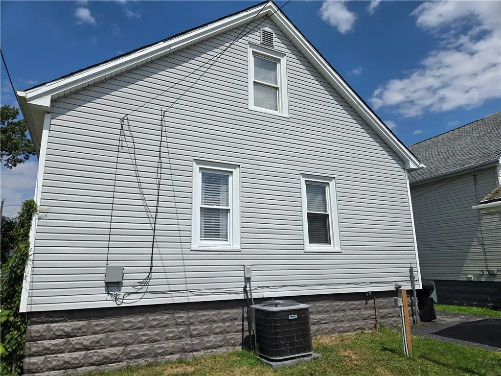 Rear view of the home and the NEW A/C condenser.