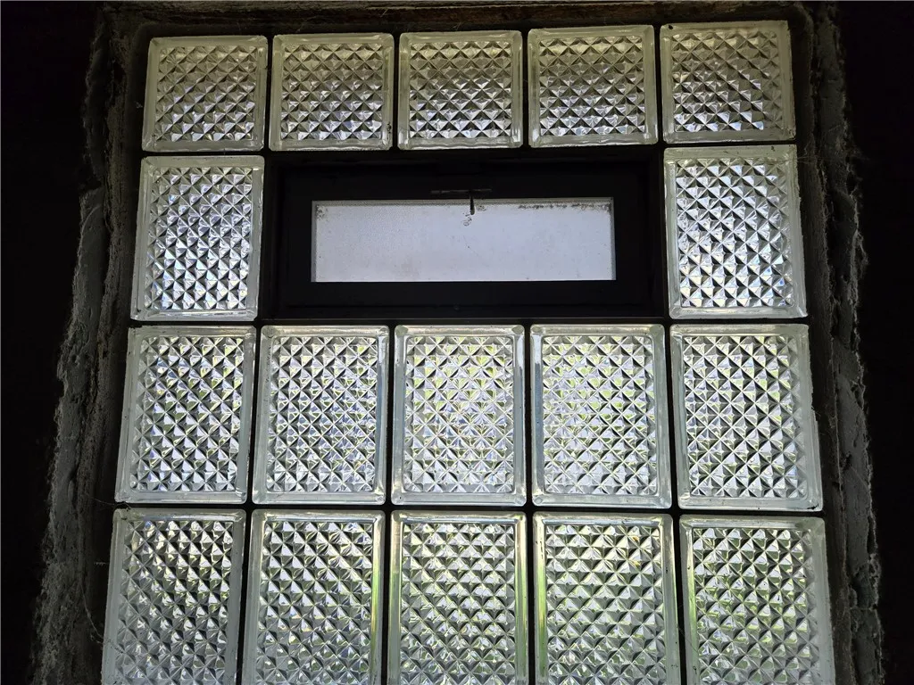 Glass block windows with center crank vents.
