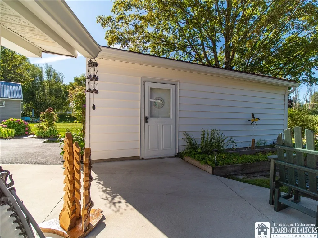 Detached 2 car garage with an herb garden getting ready for you to enjoy