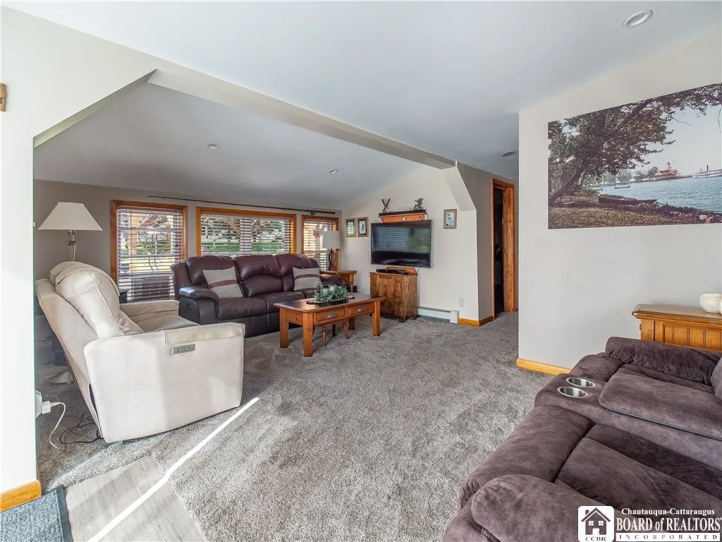 Large living room overlooking the back of the property. New carpet in here.