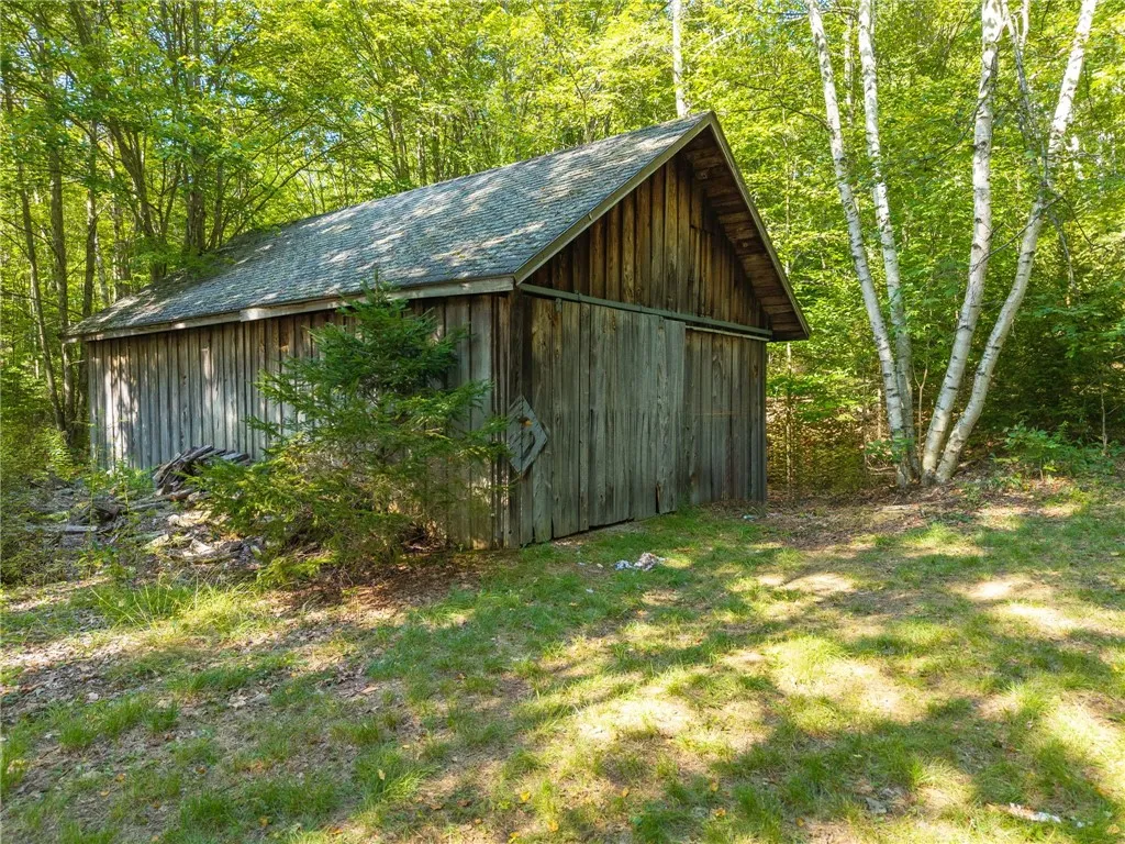 Barn, setting in woodrow behind home.