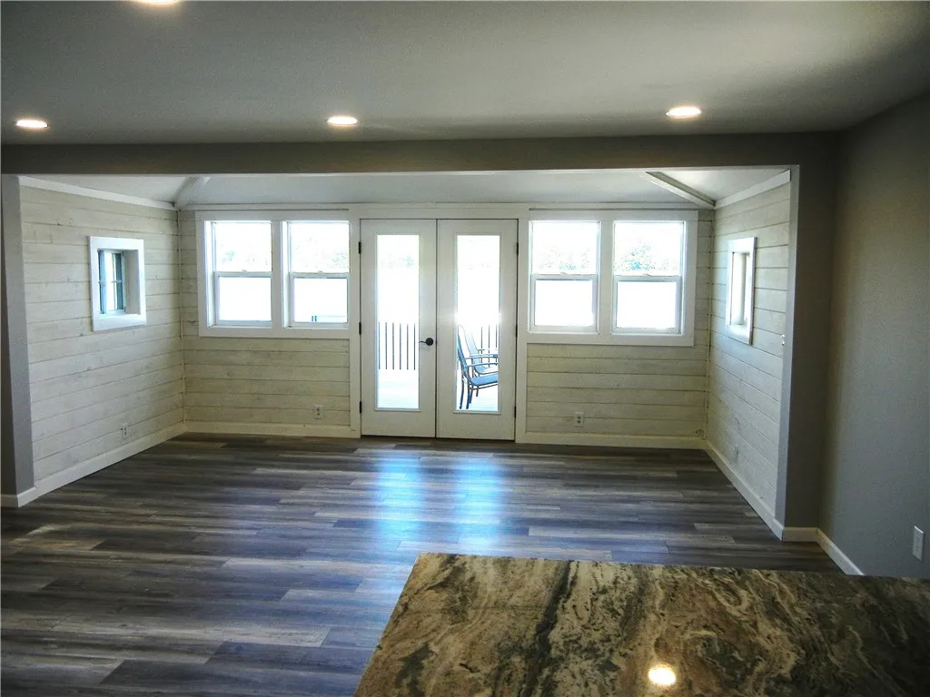KITCHEN TO LIVING AREA AND NEW FRENCH DOORS TO DECK