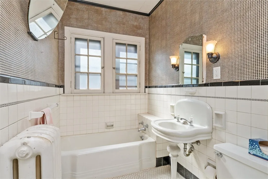 Classic Full Bath with black & white tile, separate tub & shower unit