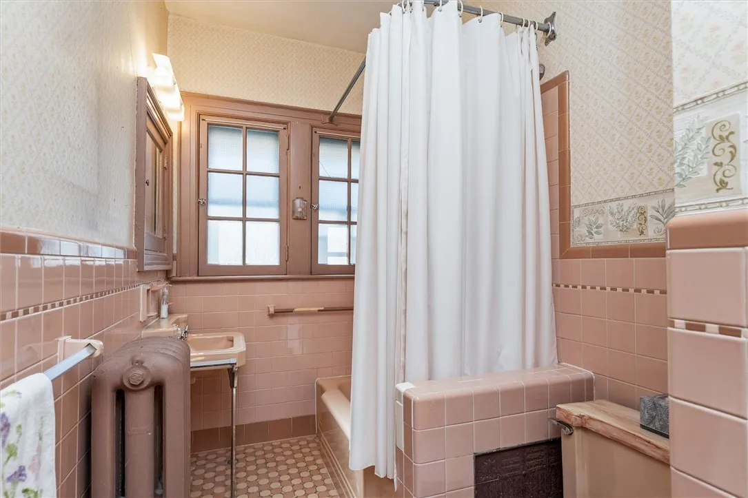 Full Bath in Unit 2 with tiled tub/shower