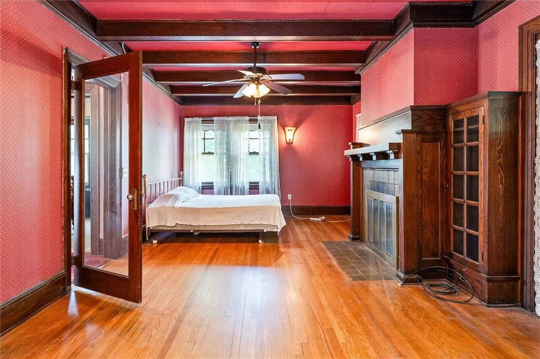 Beautiful beamed ceiling and hardwood floors in Living Room