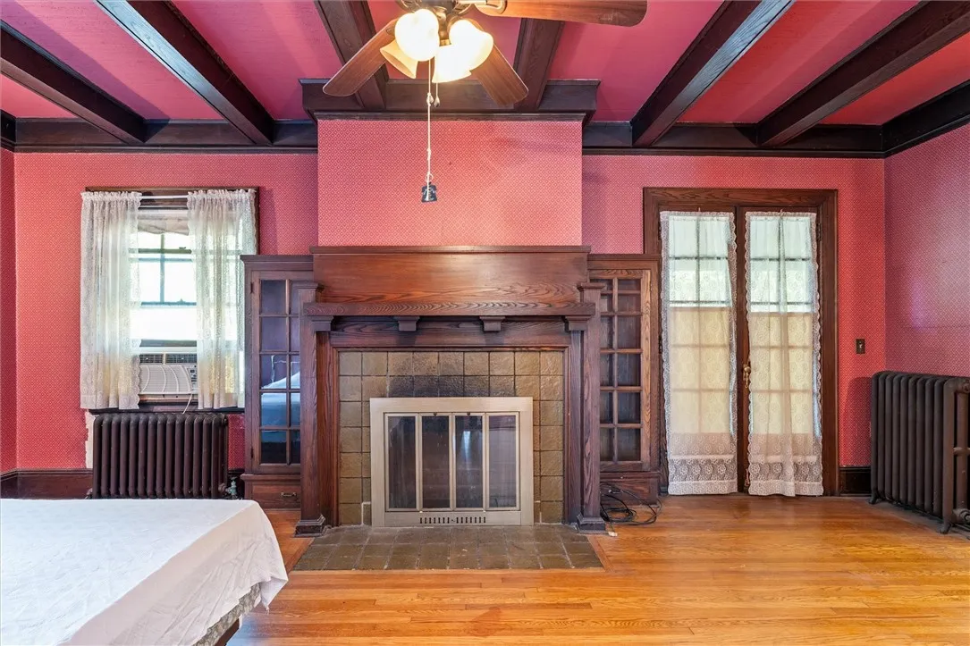 Amazing wood beamed ceiling & wood burning fireplace in the front room