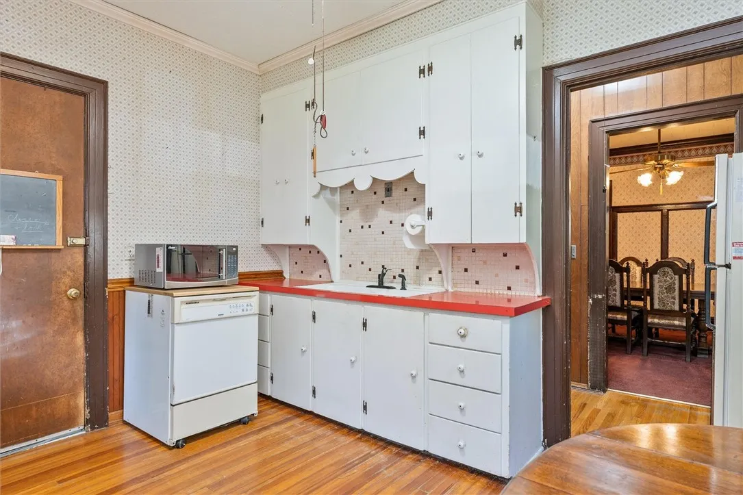 Eat-in Kitchen with white painted cabinetry