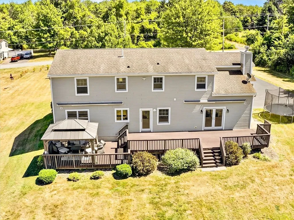 Large composite deck with gazebo and two awnings