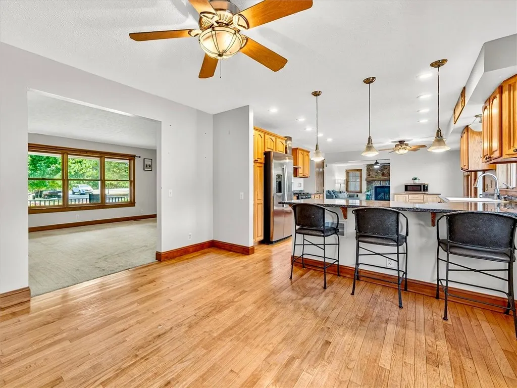 Open dining room area looking into the living room and kitchen