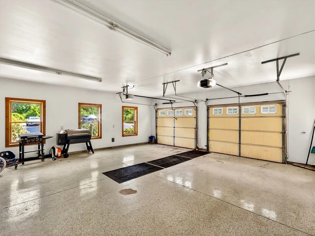 Garage with epoxy floor and two new overhead door openers