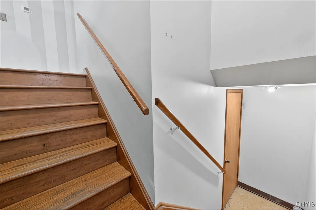 Stairs to front door and basement/garage