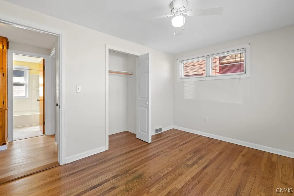 Bedroom #1 Spacious Closet Space Overlooking Hallway into Full Bathroom