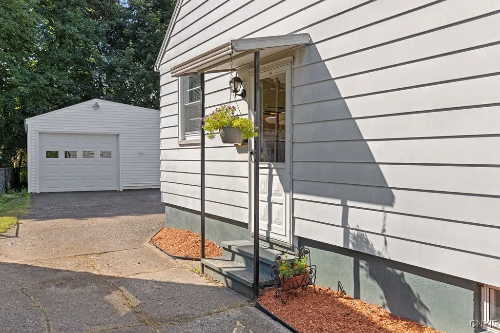 Side Entrance of the House Overlooking Detached 2 Car Garage