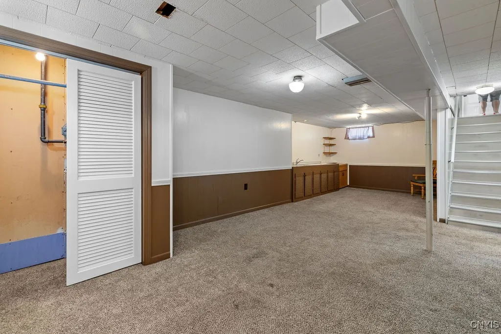 Partially Finished Basement overlooking Closet, Sink/Wet Bar with cabinet space