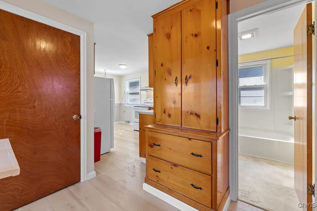 Hallway Overlooking 1st Floor Bathroom, Built Ins, and Kitchen