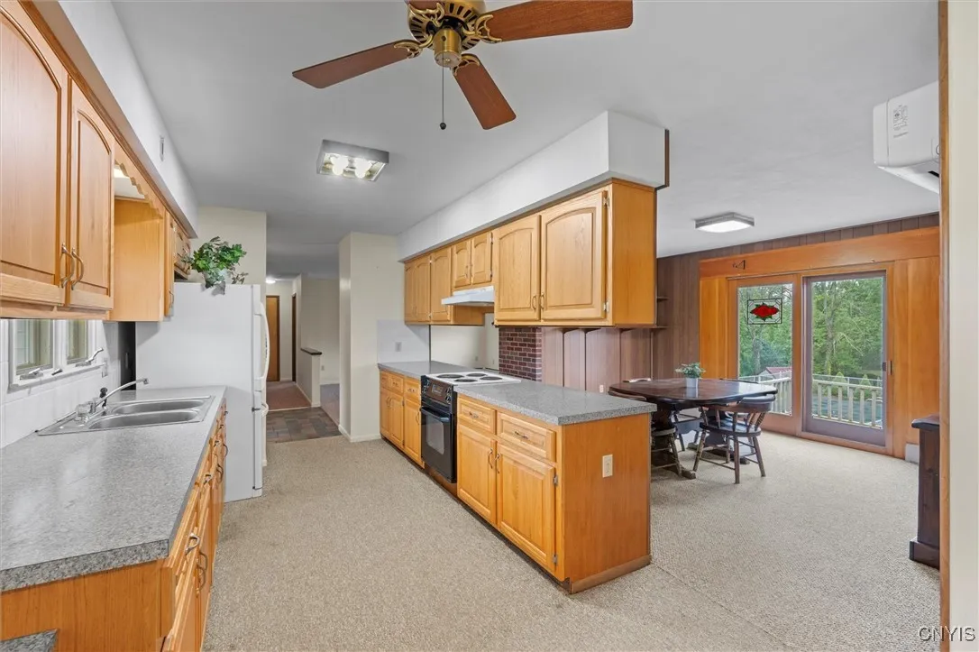 Galley kitchen adjoins dining room