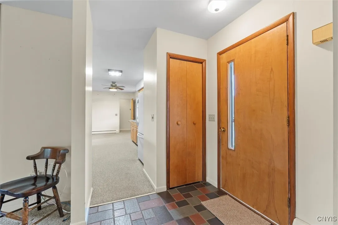 Entry tiled with closet