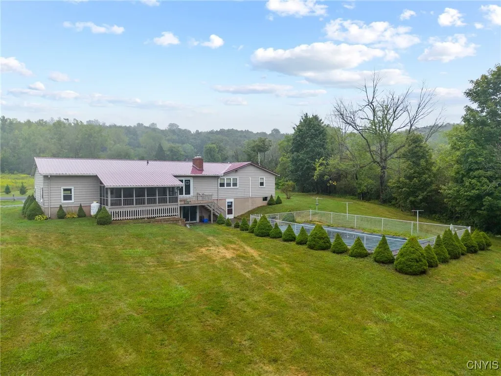 Back deck & enclosed porch, paved patio to pool