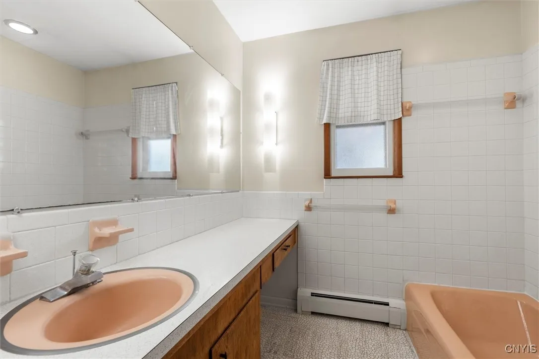 Full bath with tiled shower
