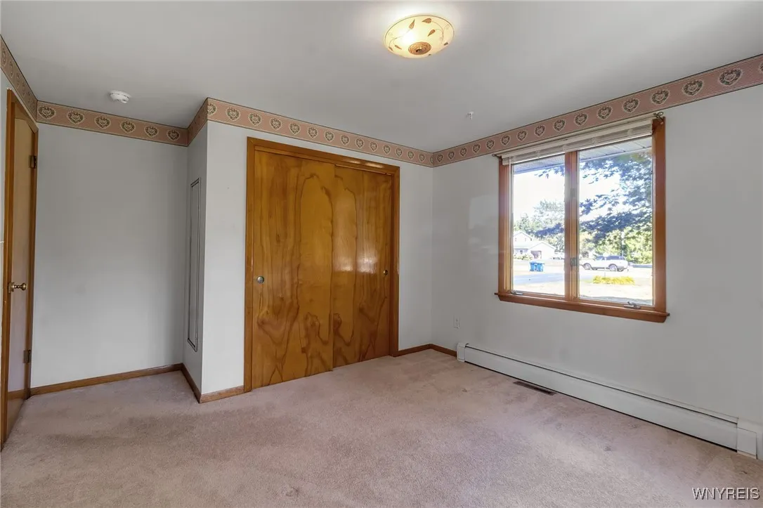2nd Bedroom with cedar chest in closet.