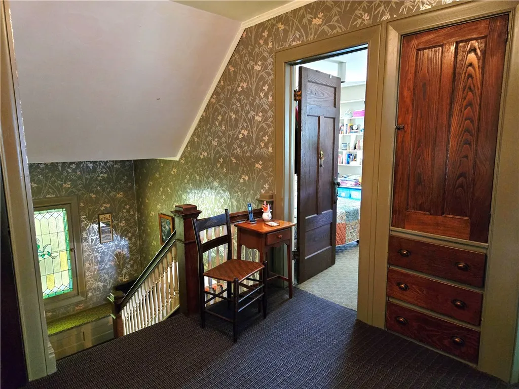 The full landing on the second floor is spacious enough for several pieces of furniture.