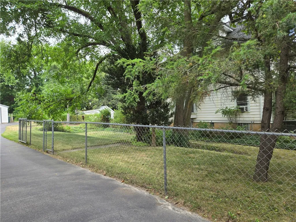 The lot next door is also included in the sale.