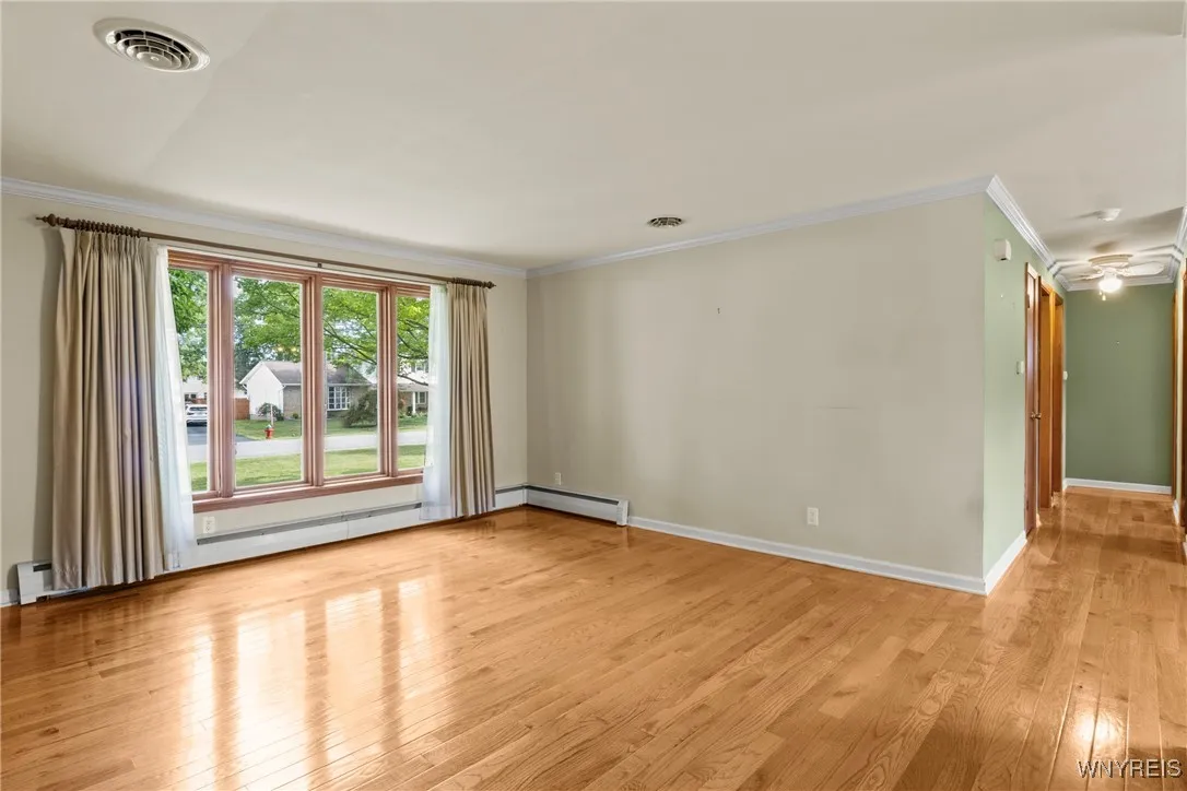bright living room with gleeming hardwood floors