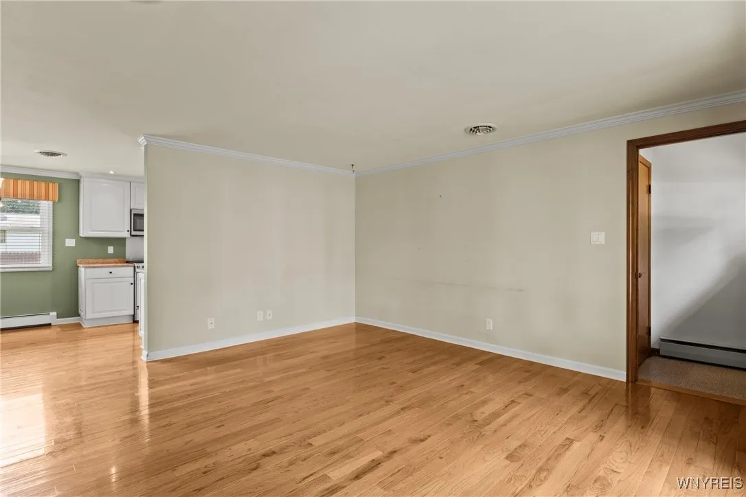 living room leads to dining area and kitchen