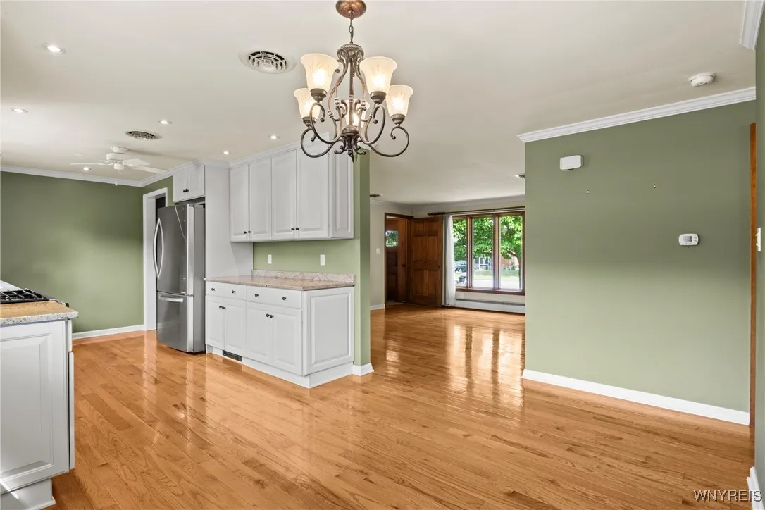 kitchen includes stainless refrigerator