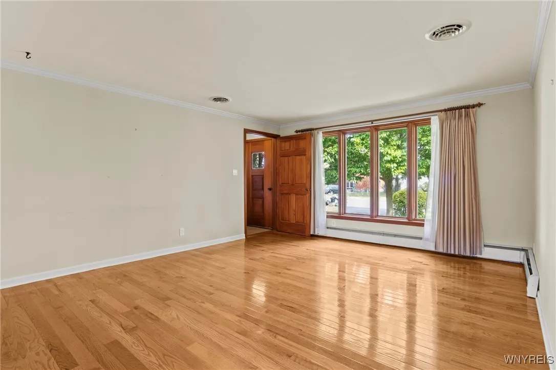 living room with front entry hall with coat closet