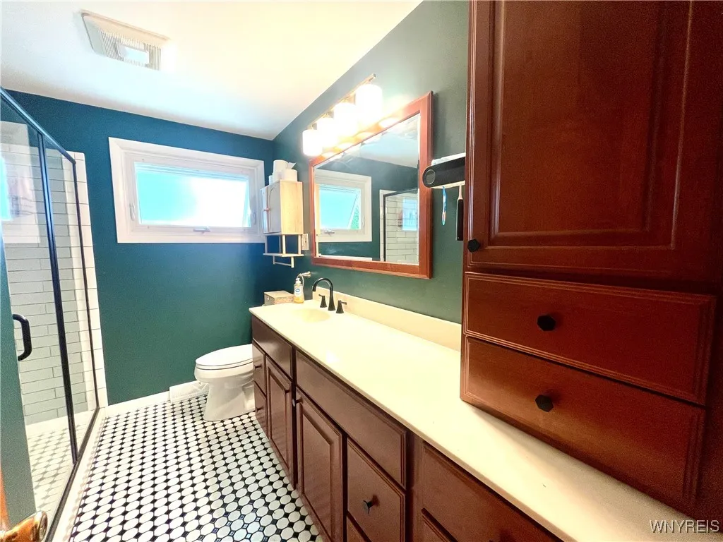 Remodeled bathroom with walk in shower.