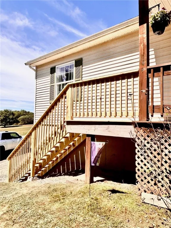 New front steps leading to covered front entry deck.
