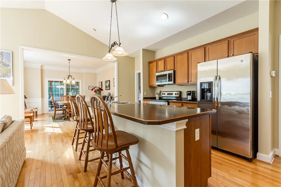 COOK'S KITCHEN WITH BEAUTIFUL CABINETRY & BREAKFAST ISLAND