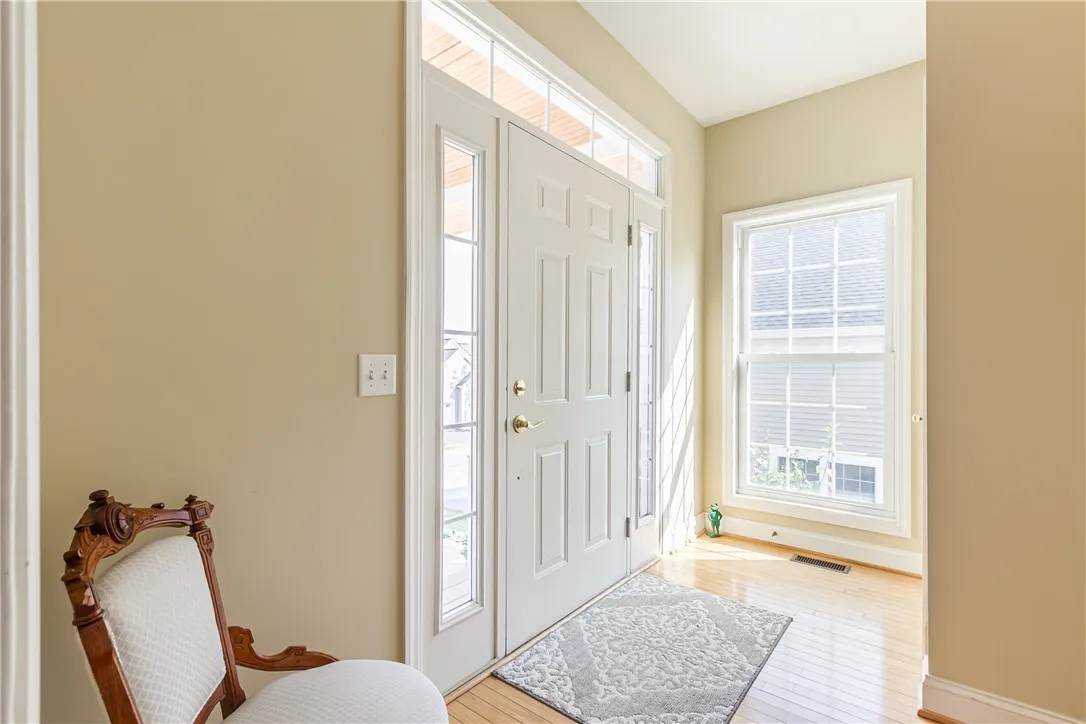 LIGHT & BRIGHT FOYER WITH TRANSOM WINDOW & SIDE LIGHTS!