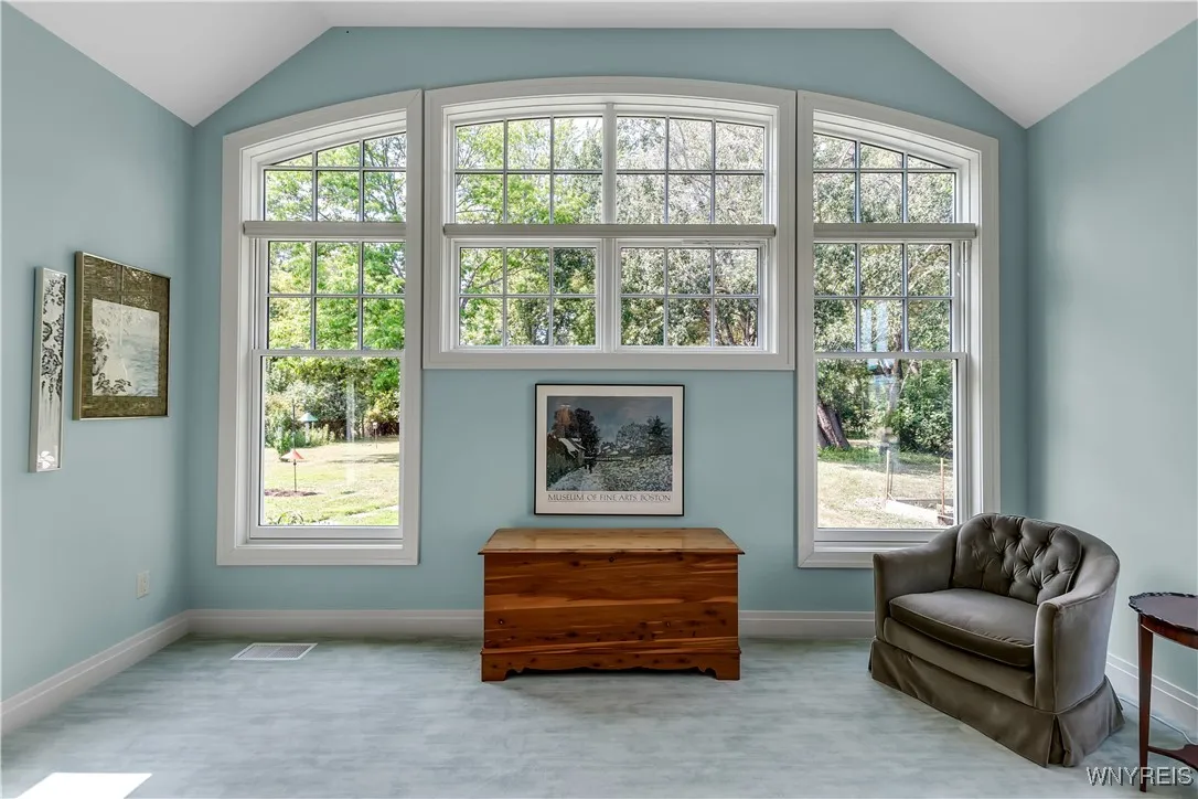 First floor primary bedroom overlooking the beautiful yard