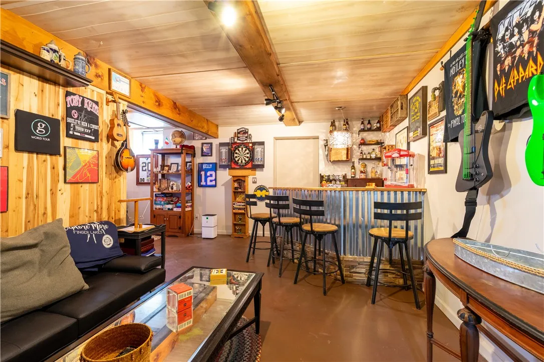 Lower level finished area - bar stays! Great entertaining space or could be an in-law area, or STR!