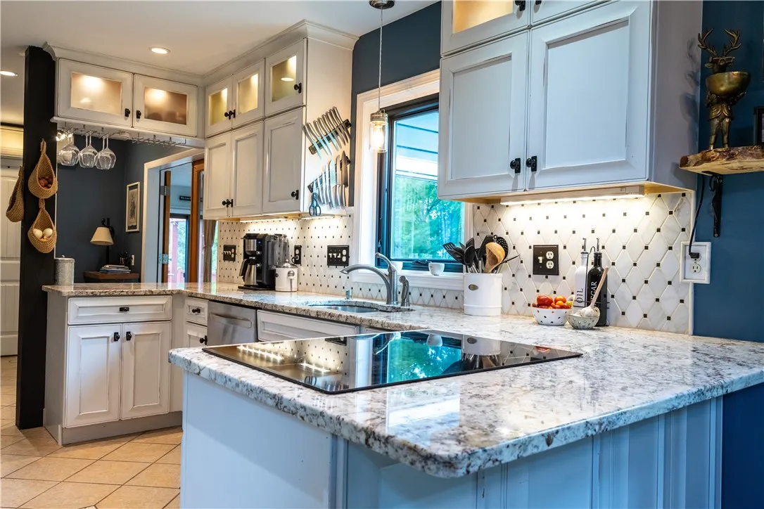 Beautiful, upscale kitchen cabinetry and granite countertops - TWO breakfast bar areas! This home is an entertainer's delight anytime of the year, inside or out!