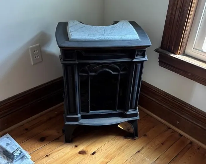 Foyer upstairs. Free standing gas fireplace