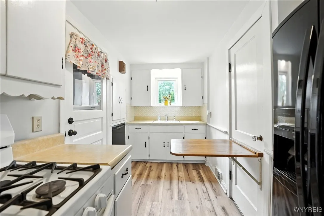 Convenient pop up table for additional counterspace as needed. Folds away when not in use.