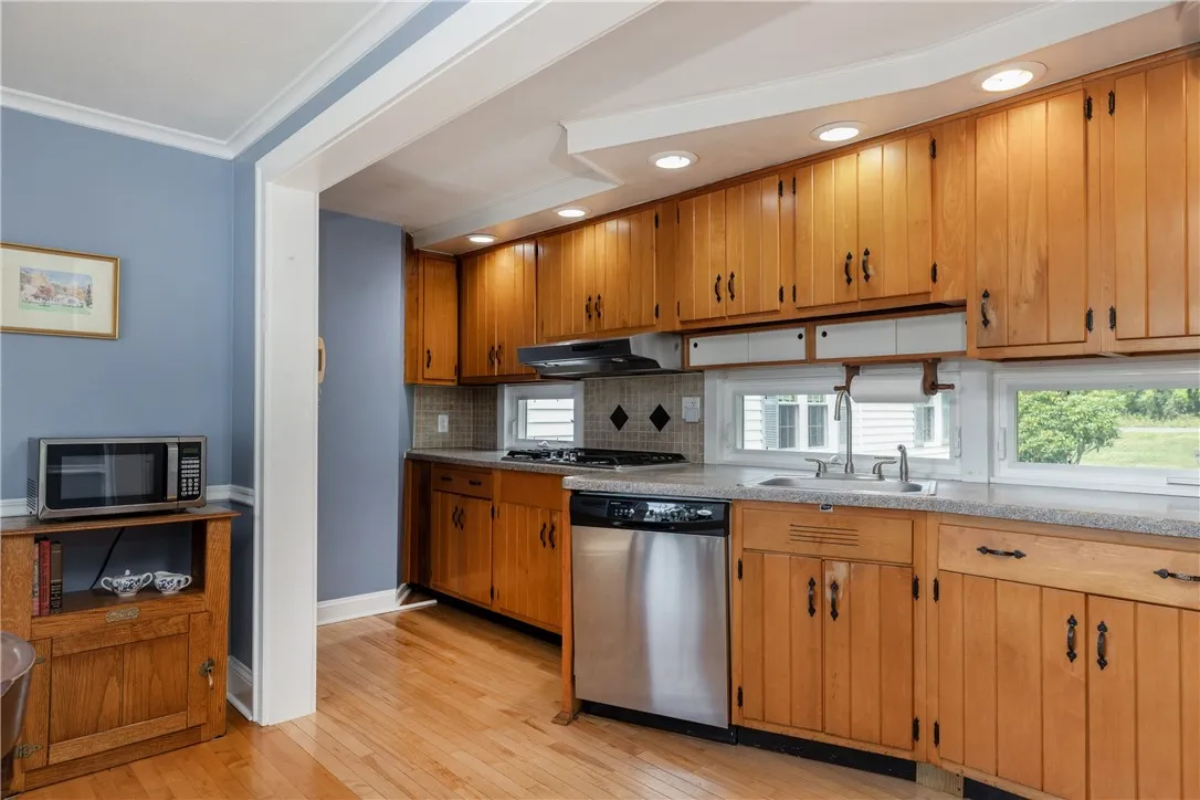Hardwood floors in kitchen and tons of cupboard space