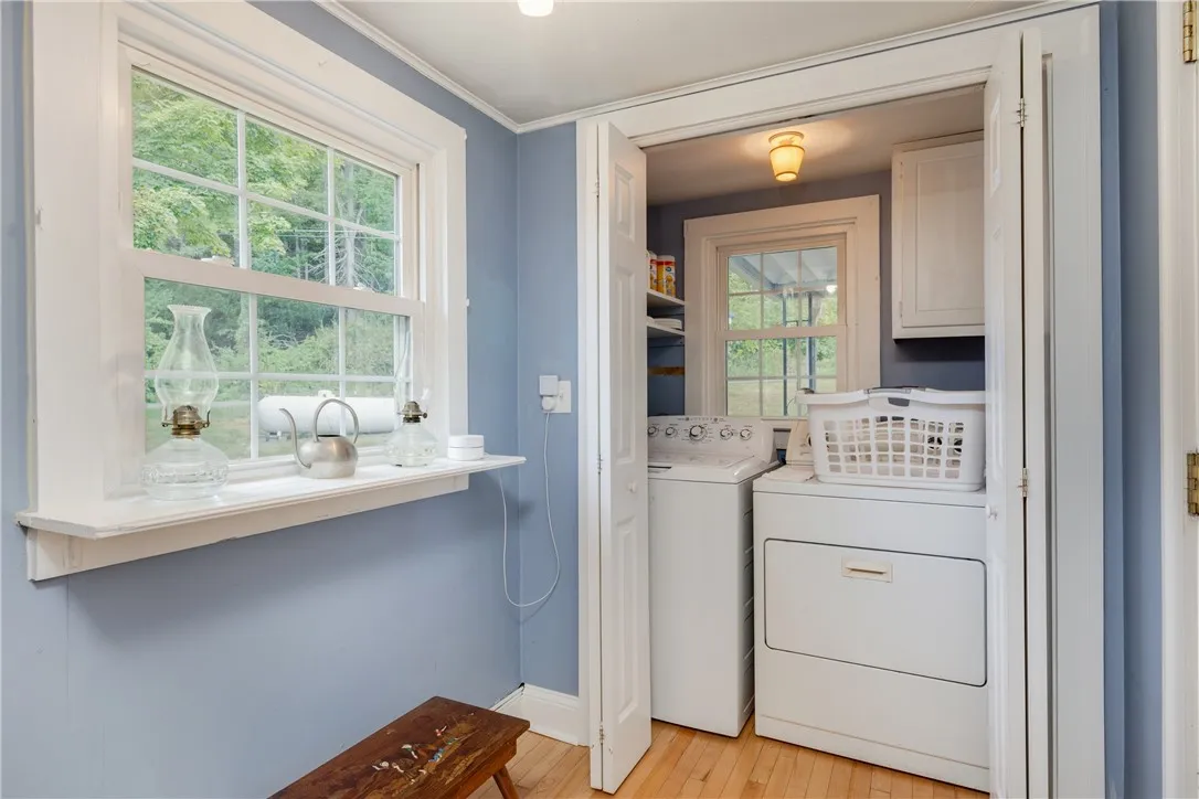 Laundry near the back door entrance and off of the kitchen